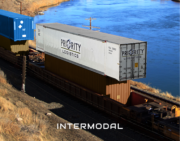 Priority Logistics container being transported intermodally over rail 